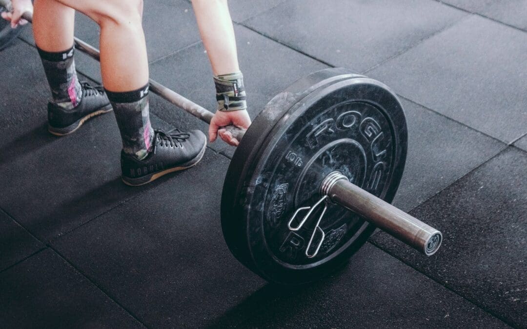 person holding barbell